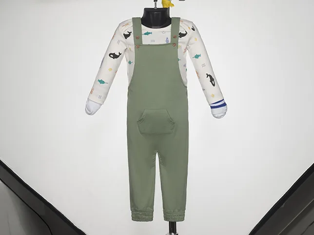 Child&rsquo;s printed dungarees before a complex recolour that leaves the printed sleeves alone