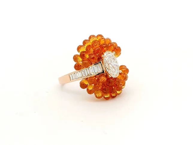 Orange fire opal cluster ring before a mirror reflection was created