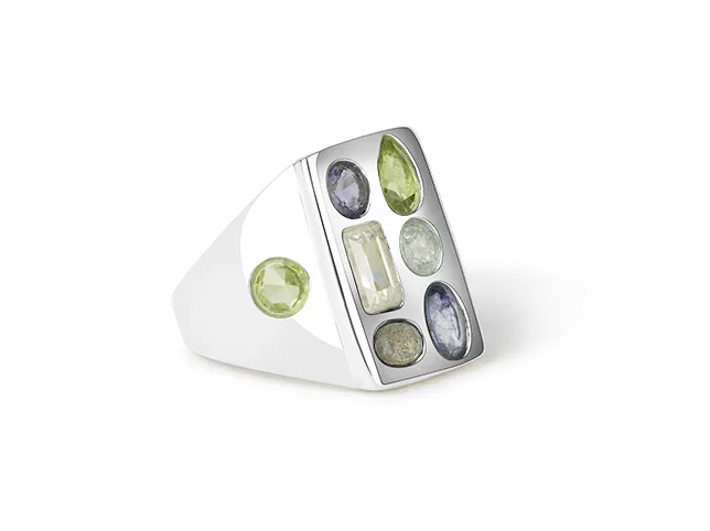 Silver ring set with translucent gemstones after masking that keeps the stones see-through