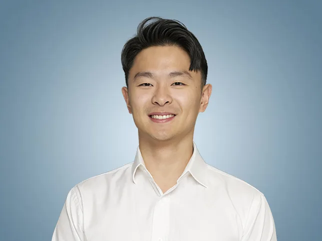 Man in a white shirt after the studio backdrop was replaced