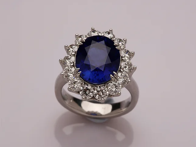 Sapphire halo engagement ring before stone and facet retouching at full zoom