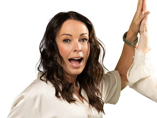 Woman photographed against a green screen after hair masking onto white