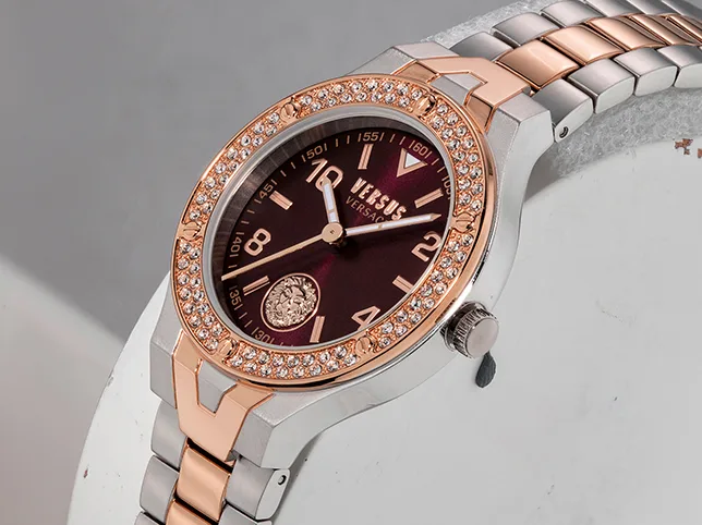 Rose gold and steel wristwatch before dust and scratch removal