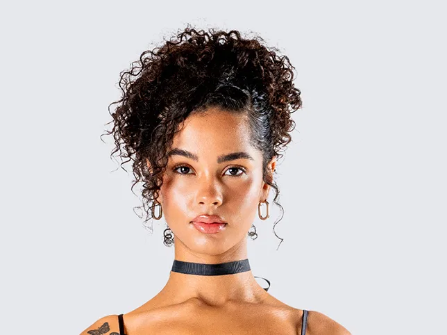 Model in a choker before background cleanup for an eCommerce cut-out