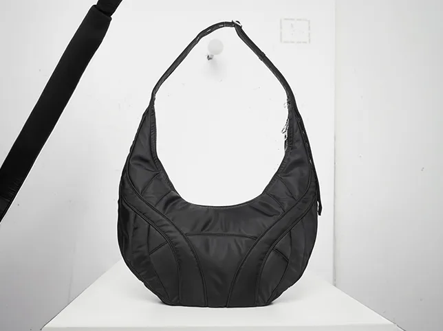 Black shoulder bag before product enhancement with a shadow added