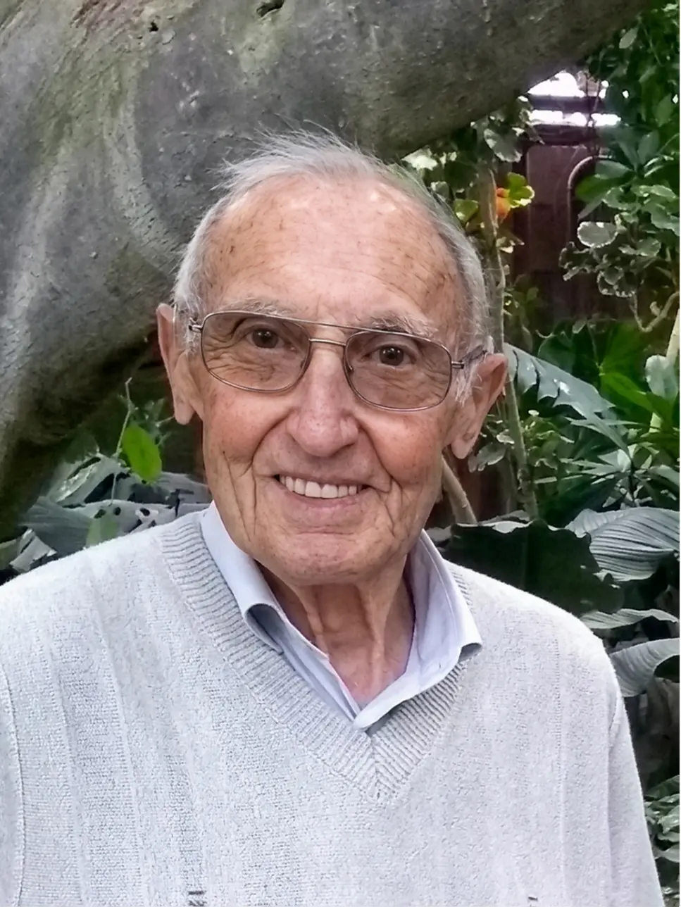 Black and white portrait of an older man after restoration and colourisation