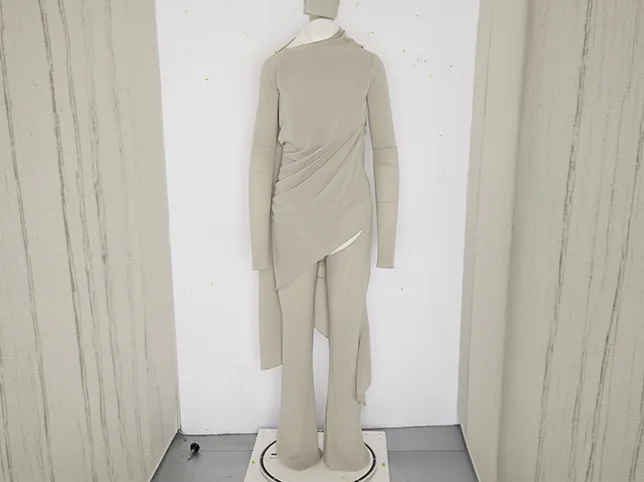 Beige draped dress with packaging creases