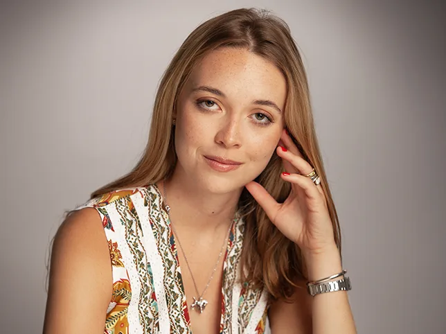 Model in an embellished top before retouching