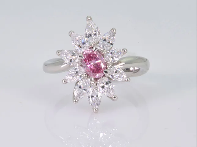 Pink sapphire cluster ring before retouching