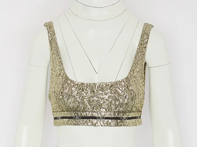 Gold sequinned crop top before the mannequin was removed and the sequin detail recovered