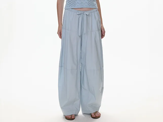 Light denim wide-leg trousers before the mannequin was removed and the waist tie kept in place