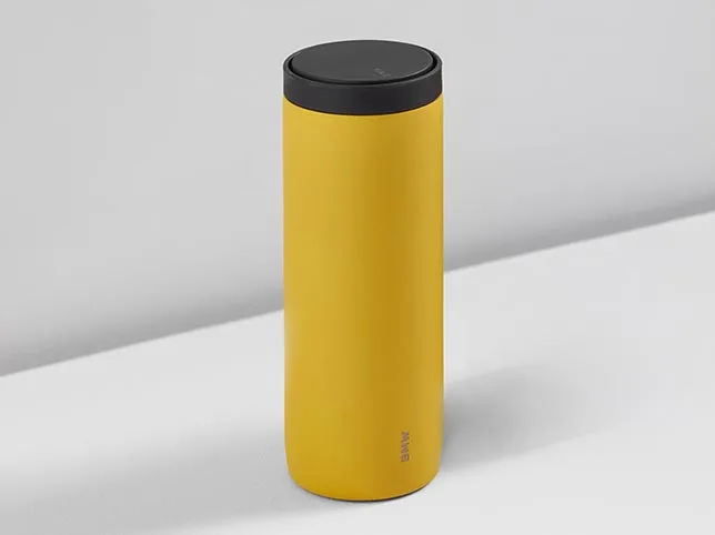 Insulated travel tumbler after a commercial colour change from silver to yellow
