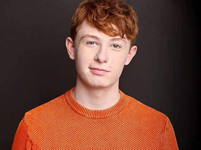 Studio portrait of a young man before frequency separation skin retouching