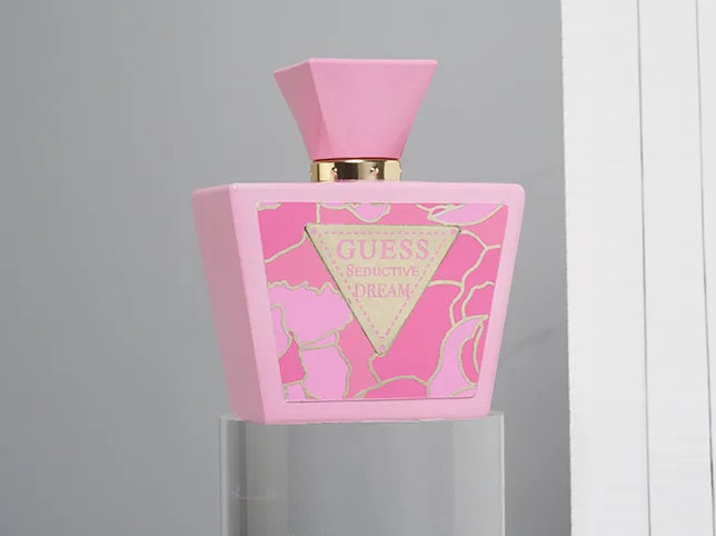 Pink patterned perfume bottle before beauty product retouching