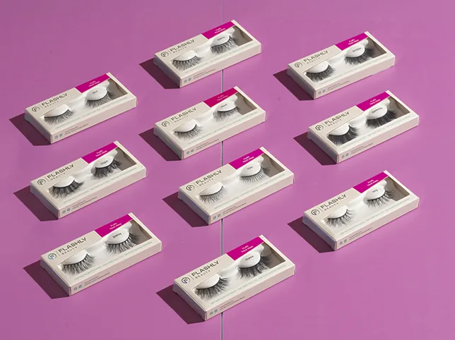 Lash boxes on a pink backdrop before colour and contrast were lifted for a feed thumbnail