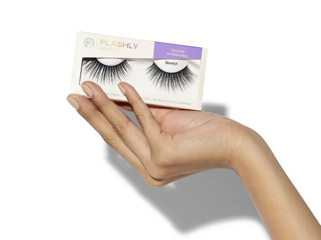 Hand holding a lash box after the skin and packaging were cleaned and evened