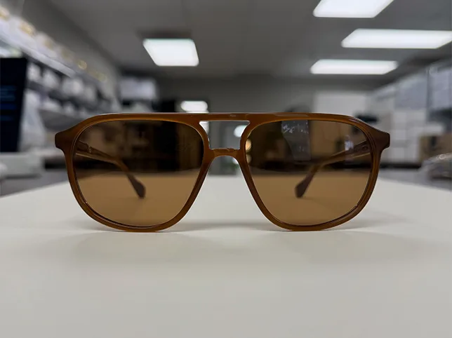 Vintage brown sunglasses before the shot was straightened, squared and sized for listing
