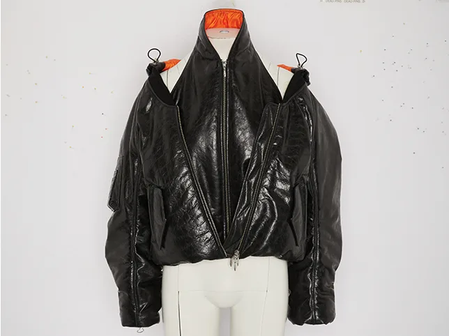 Black leather jacket before vintage retouching that keeps the wear visible