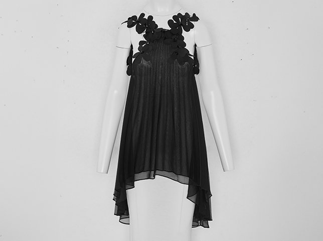Black dress on a mannequin before ghost mannequin retouching